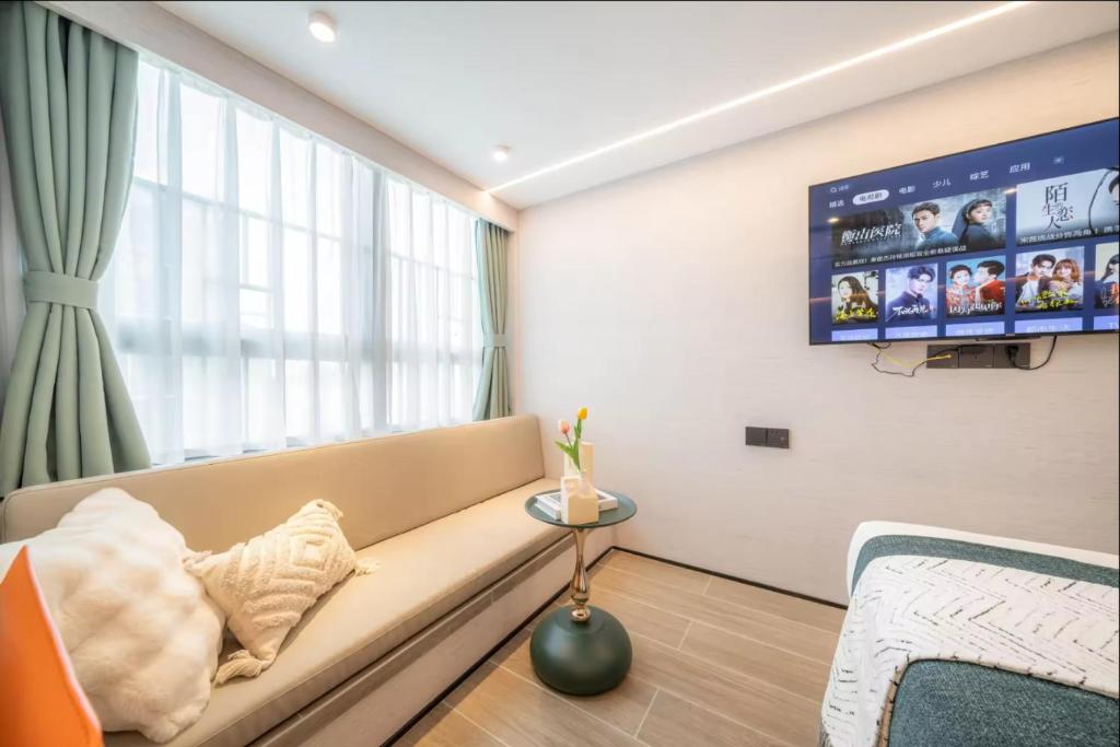 TV a/nebo společenská místnost v ubytování Yunbo Hotel