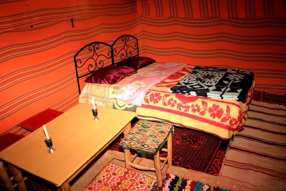 Un ou plusieurs lits dans un hébergement de l'établissement Bivouac Le Petit Prince Merzouga