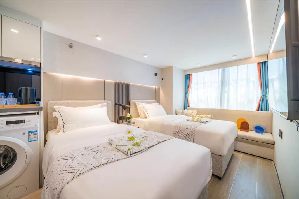 Postel nebo postele na pokoji v ubytování Yunbo Hotel