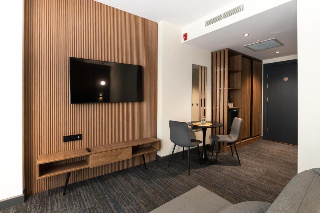 TV a/nebo společenská místnost v ubytování NOVA LUXE Hotel & Residences