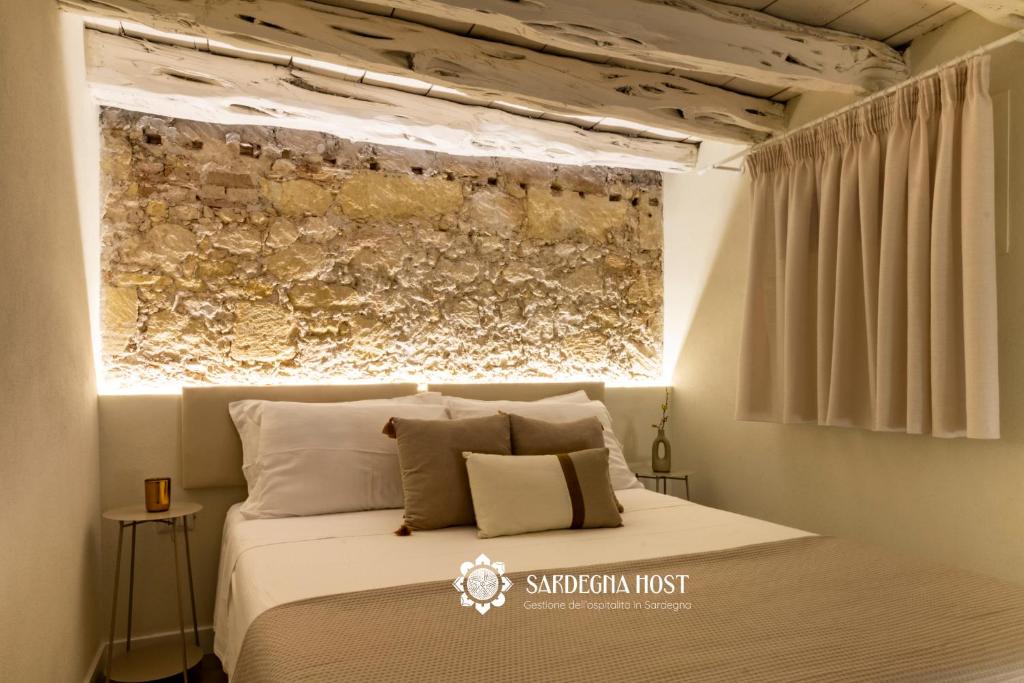 Postel nebo postele na pokoji v ubytování Sardegna Host Il Nido