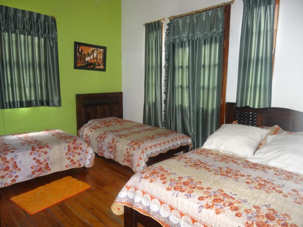 Postel nebo postele na pokoji v ubytování Hostal del Piamonte