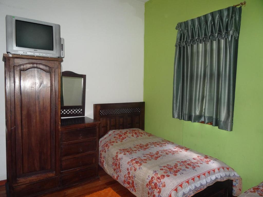Postel nebo postele na pokoji v ubytování Hostal del Piamonte