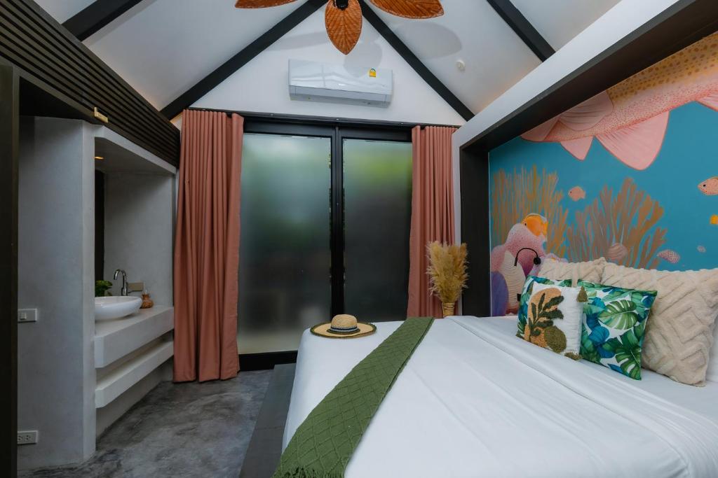 Postel nebo postele na pokoji v ubytování Tolani Resort Koh Samui