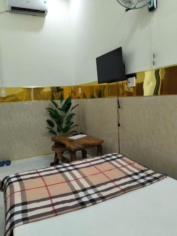 Postel nebo postele na pokoji v ubytování Tam Ky XO Hotel