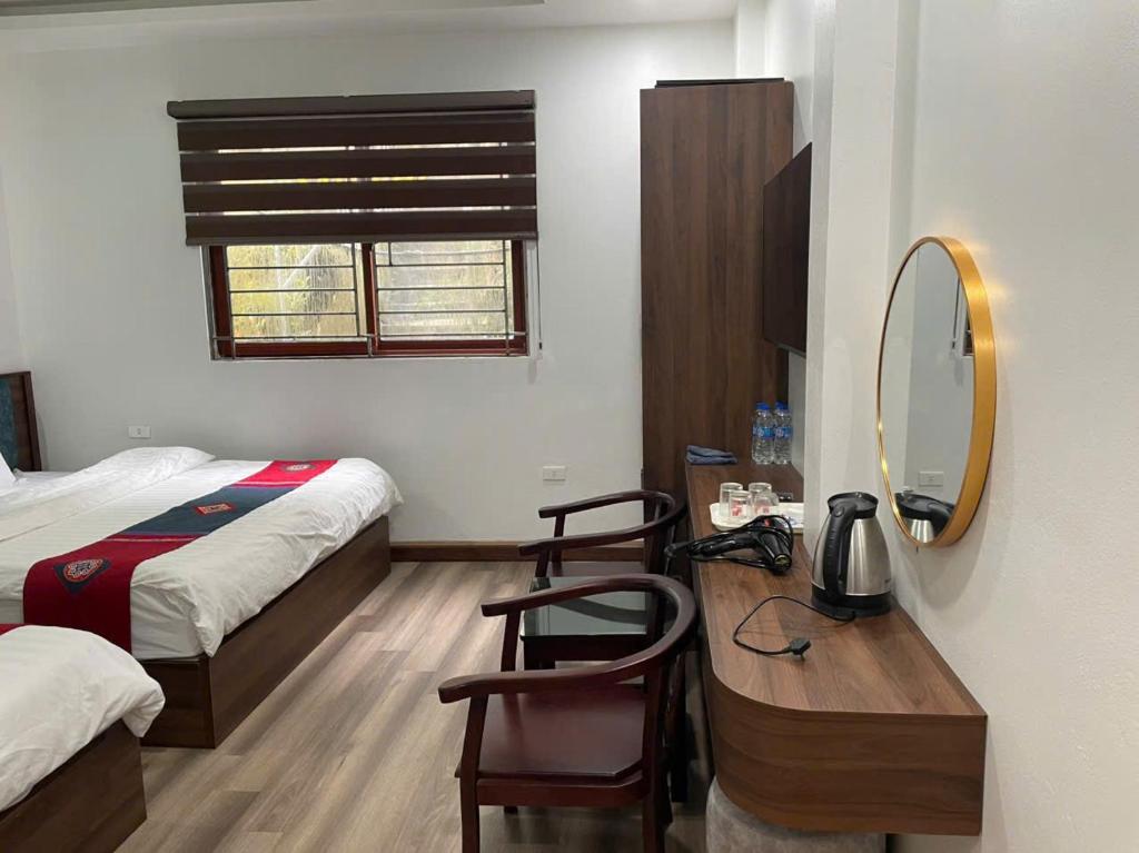 Postel nebo postele na pokoji v ubytování Harmony Haven Hotel