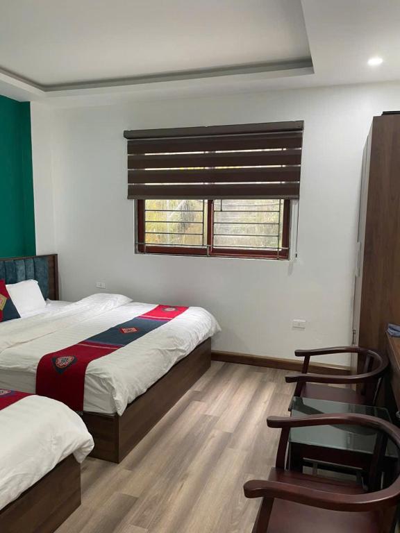 Postel nebo postele na pokoji v ubytování Harmony Haven Hotel