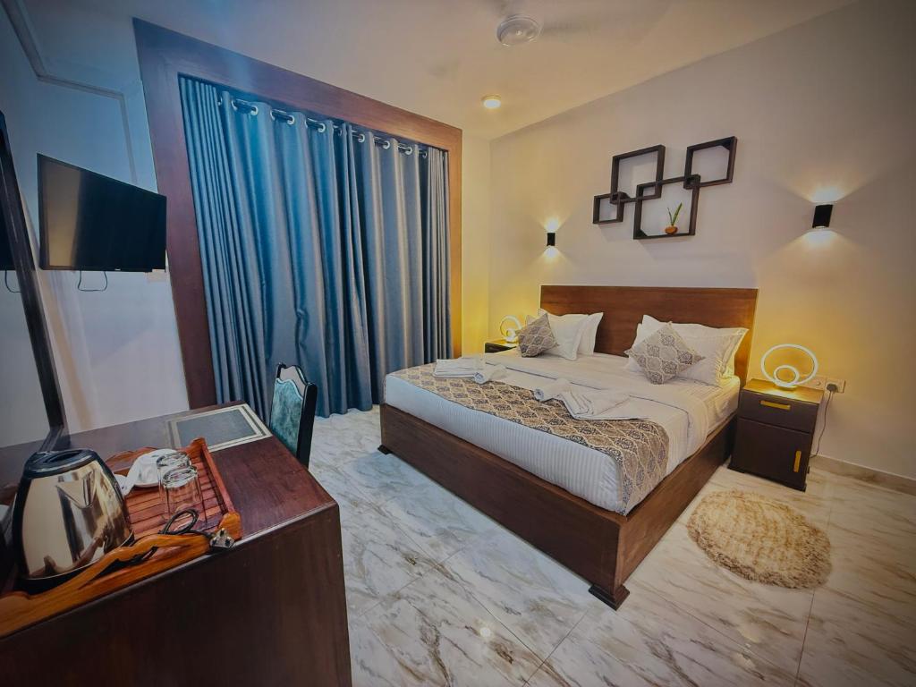 Postel nebo postele na pokoji v ubytování Aloe Transit Hotel