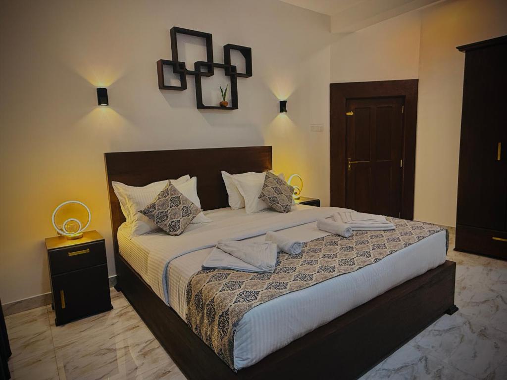 Postel nebo postele na pokoji v ubytování Aloe Transit Hotel