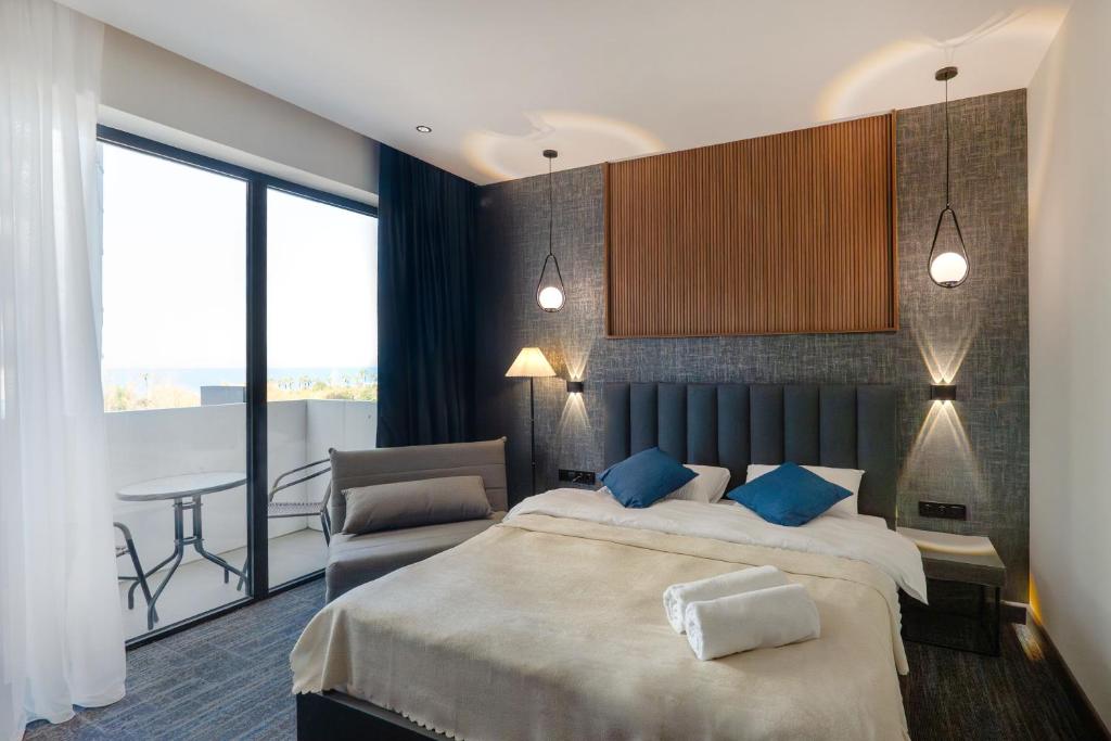 Postel nebo postele na pokoji v ubytování NOVA LUXE Hotel & Residences