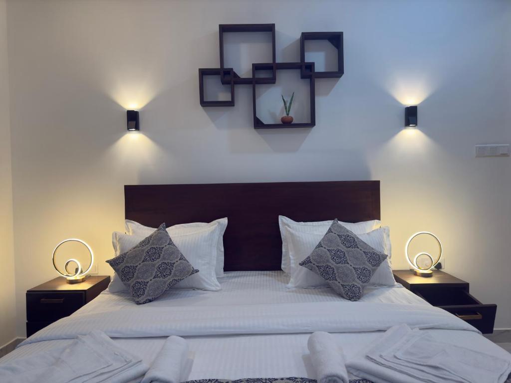 Postel nebo postele na pokoji v ubytování Aloe Transit Hotel
