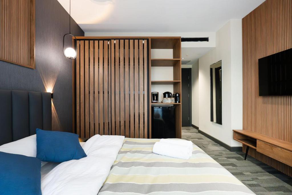 Postel nebo postele na pokoji v ubytování NOVA LUXE Hotel & Residences