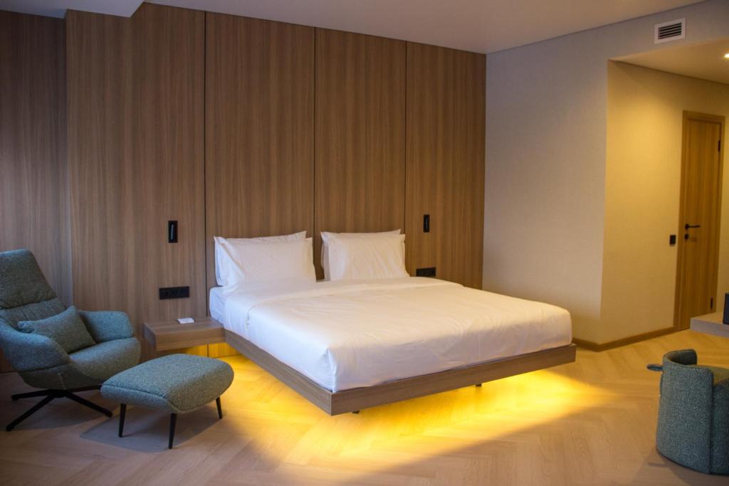 Postel nebo postele na pokoji v ubytování Resident Hotel Abay