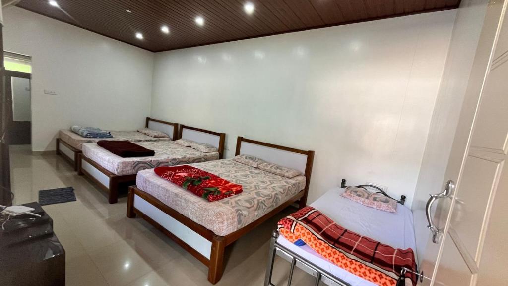 Postel nebo postele na pokoji v ubytování New Hambala Homestay