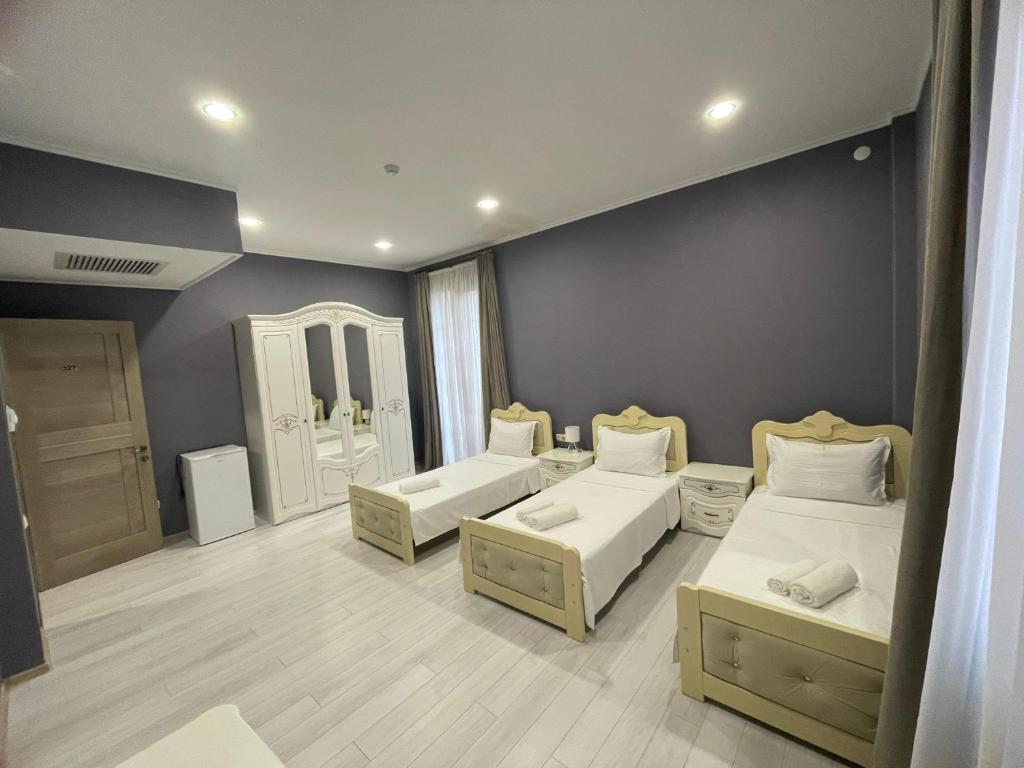 Postel nebo postele na pokoji v ubytování Astoria Hotel