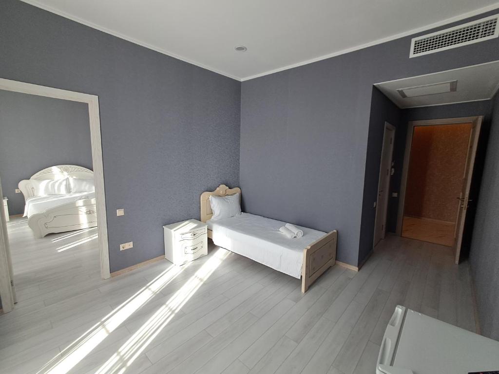 Postel nebo postele na pokoji v ubytování Astoria Hotel