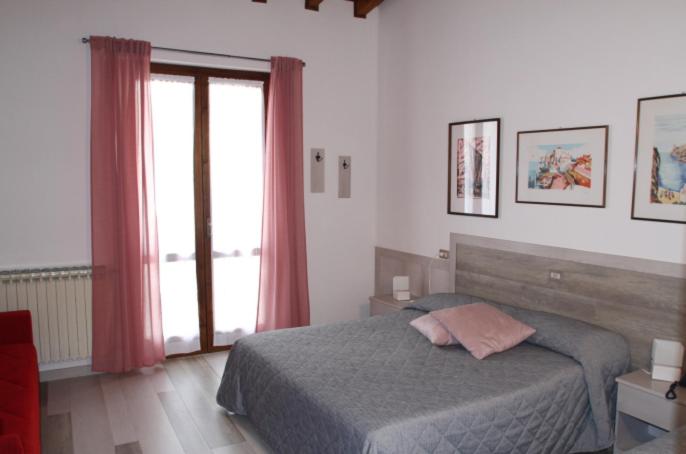 Postel nebo postele na pokoji v ubytování Hotel Colomber