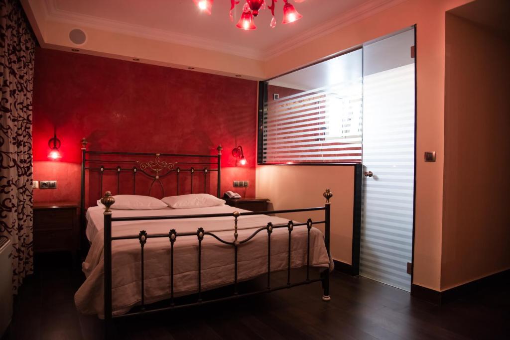 Postel nebo postele na pokoji v ubytování Hotel Maroussi