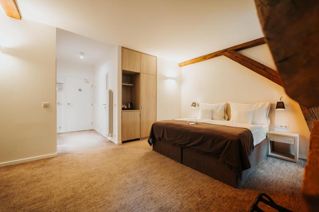 Postel nebo postele na pokoji v ubytování Hotel Château Gbeľany
