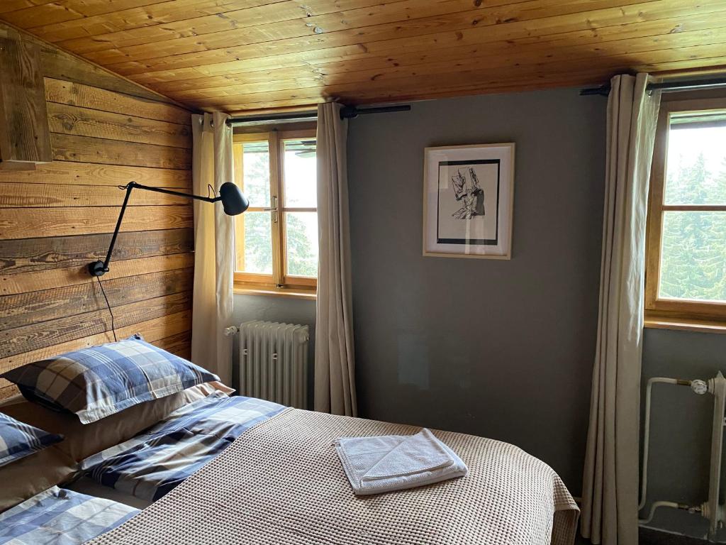 Postel nebo postele na pokoji v ubytování Bouda Šestidomí