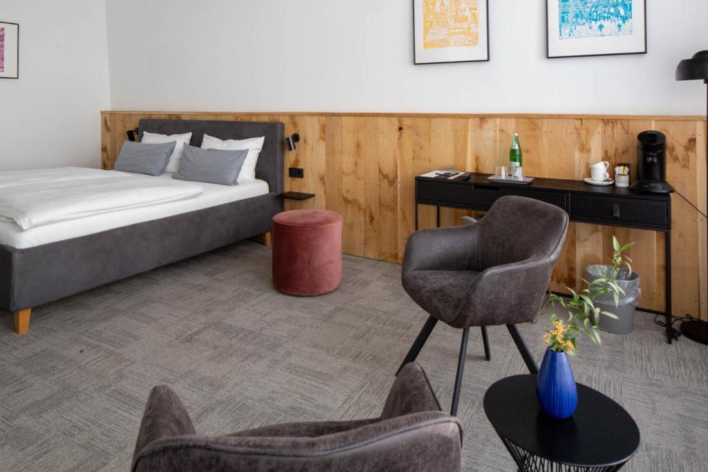 Postel nebo postele na pokoji v ubytování Wertschätzer Hotel - Krumme Str