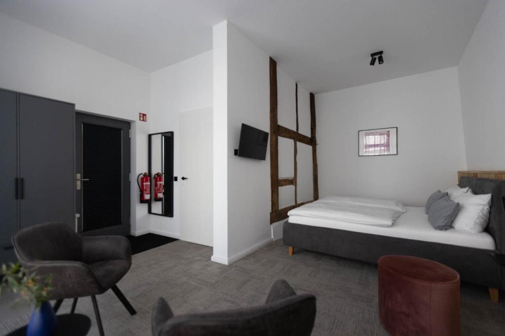 Postel nebo postele na pokoji v ubytování Wertschätzer Hotel - Krumme Str