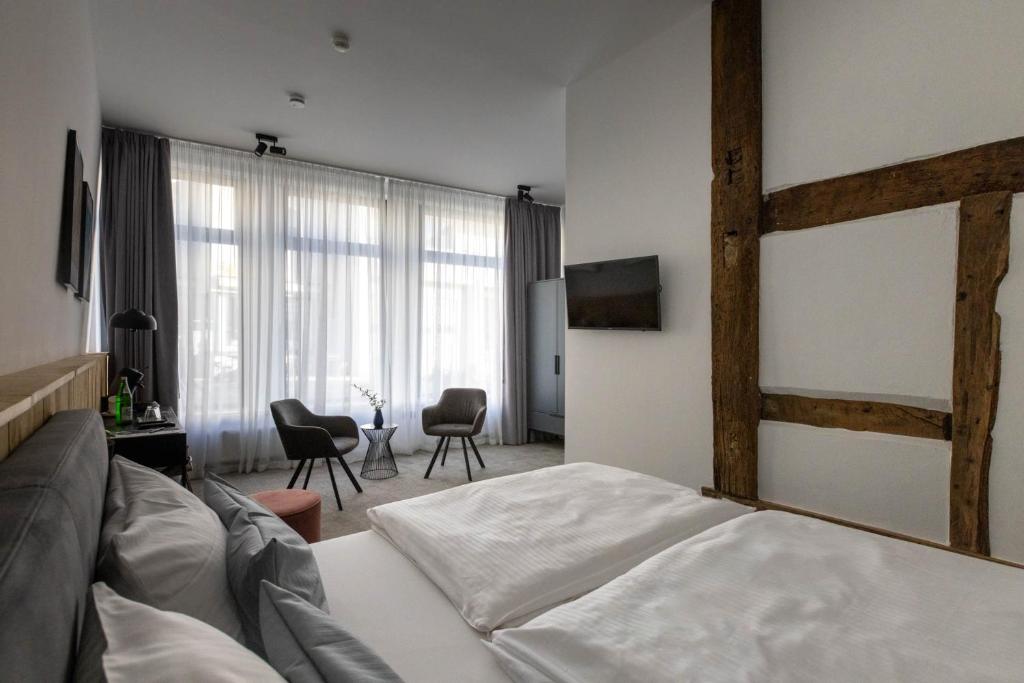 Postel nebo postele na pokoji v ubytování Wertschätzer Hotel - Krumme Str