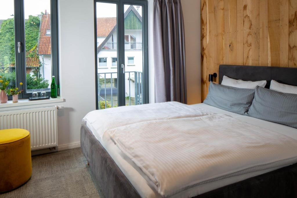 Postel nebo postele na pokoji v ubytování Wertschätzer Hotel - Krumme Str