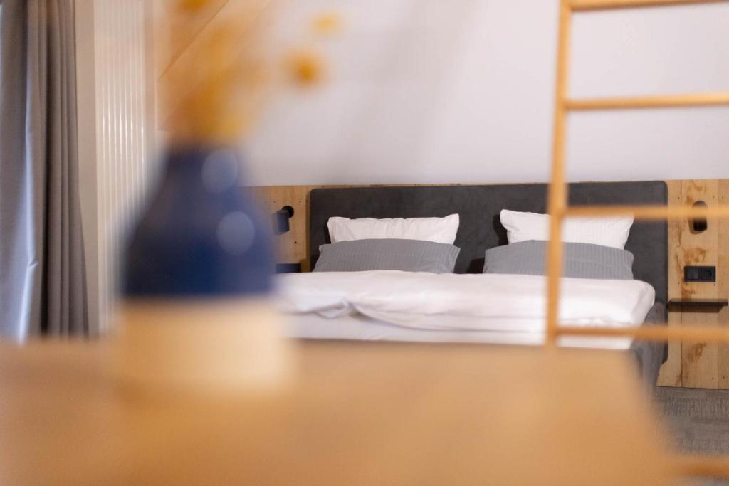 Postel nebo postele na pokoji v ubytování Wertschätzer Hotel - Krumme Str
