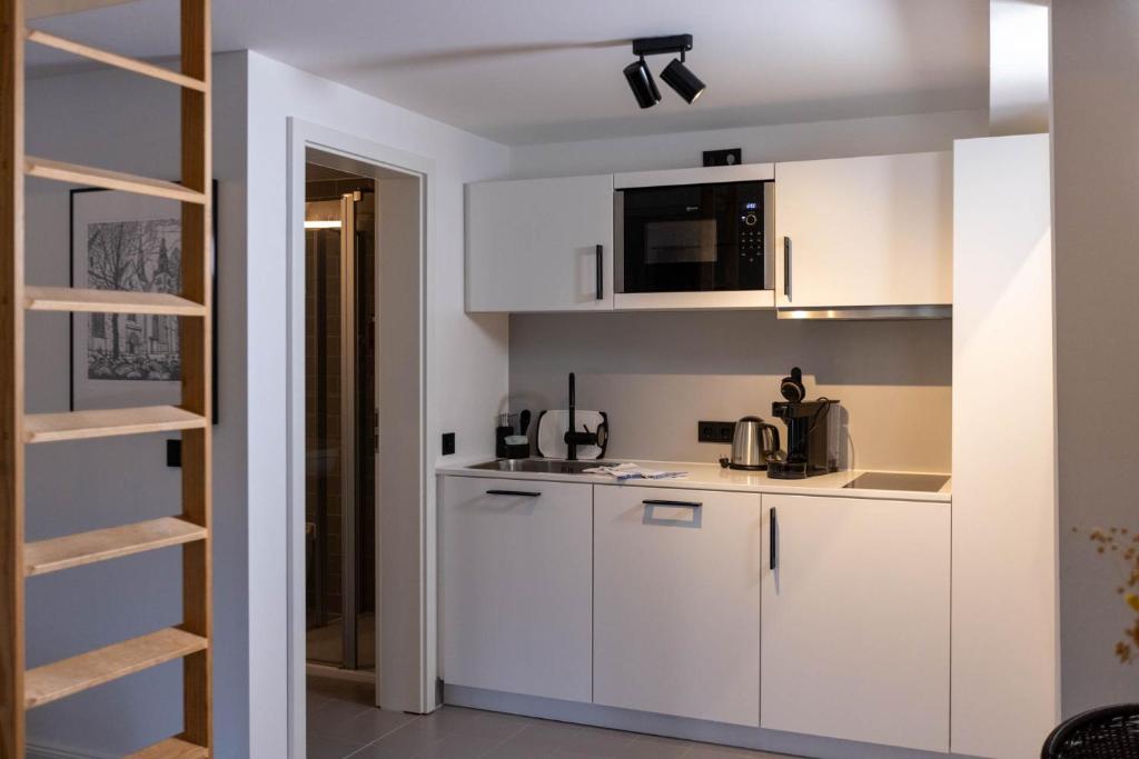 Kuchyň nebo kuchyňský kout v ubytování Wertschätzer Hotel - Krumme Str