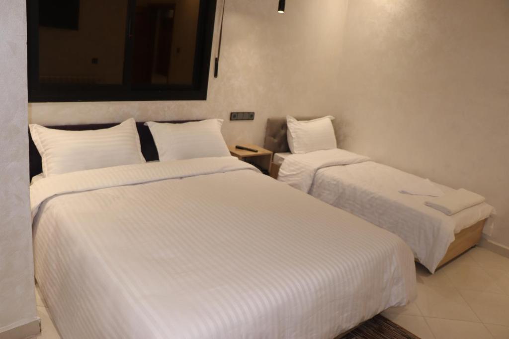 Postel nebo postele na pokoji v ubytování VANA hôtel