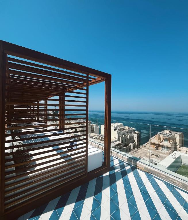 a view of the ocean from the balcony of a building at 1926 Le Soleil Hotel & Spa in Sliema