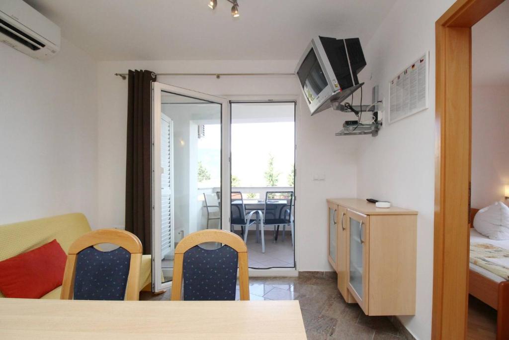 TV a/nebo společenská místnost v ubytování Apartments Mikulan Nara
