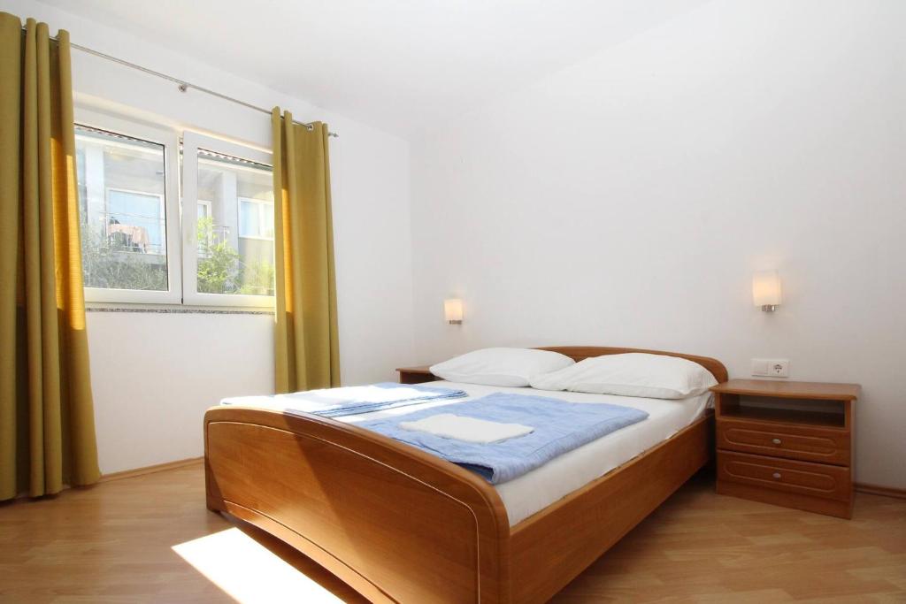 Postel nebo postele na pokoji v ubytování Apartments Mikulan Nara