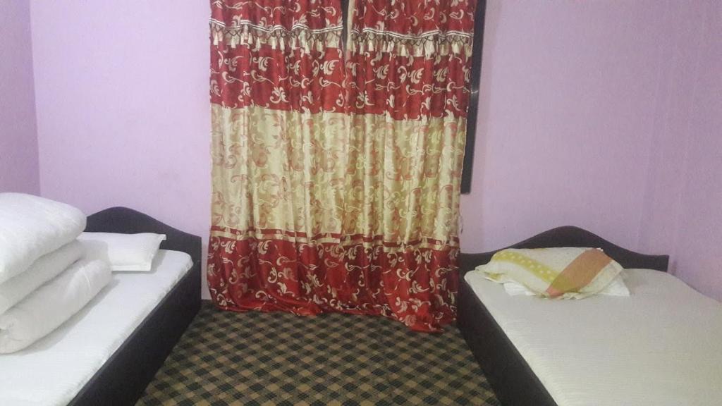 Llit o llits en una habitació de Jajarkot Home Stay