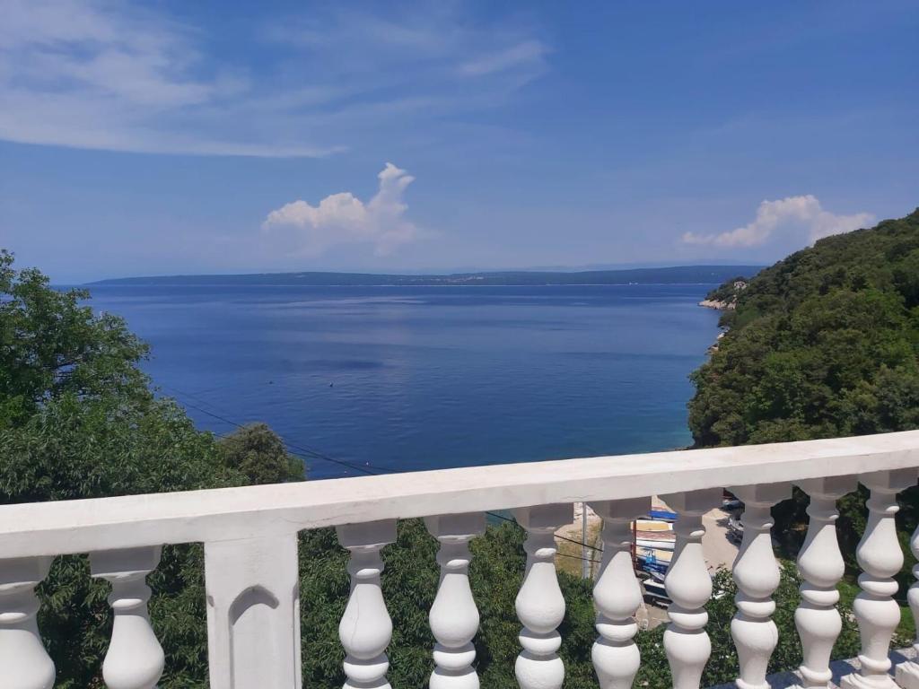 a view of the water from a balcony at Apartment Boto in Smergo