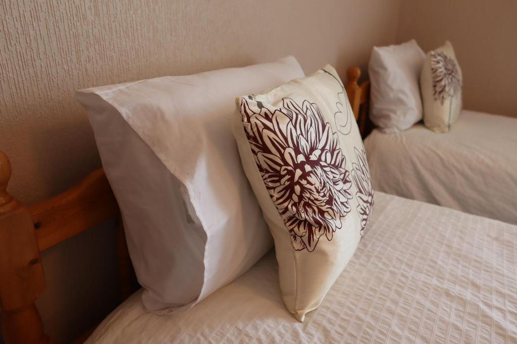 Postel nebo postele na pokoji v ubytování Dewars Rest