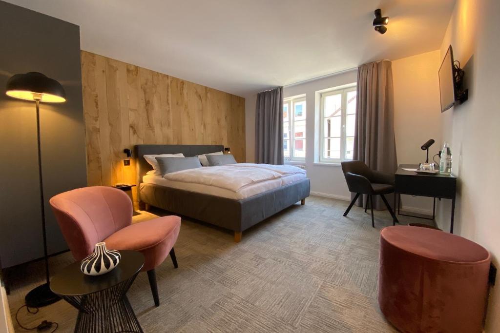 Postel nebo postele na pokoji v ubytování Wertschätzer Hotel - Krumme Str