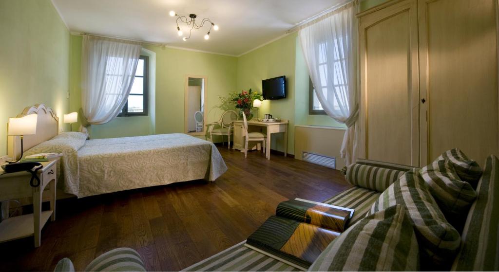 Postel nebo postele na pokoji v ubytování Relais Corte Cavalli