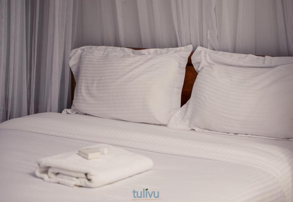 Postel nebo postele na pokoji v ubytování Tulivu Suites
