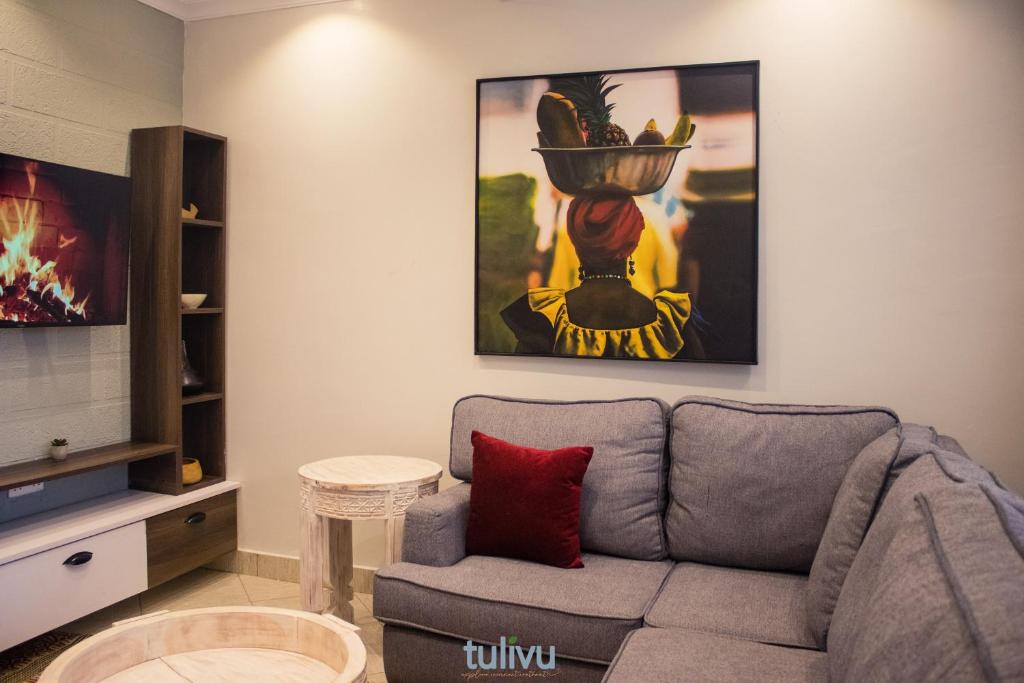 TV a/nebo společenská místnost v ubytování Tulivu Suites