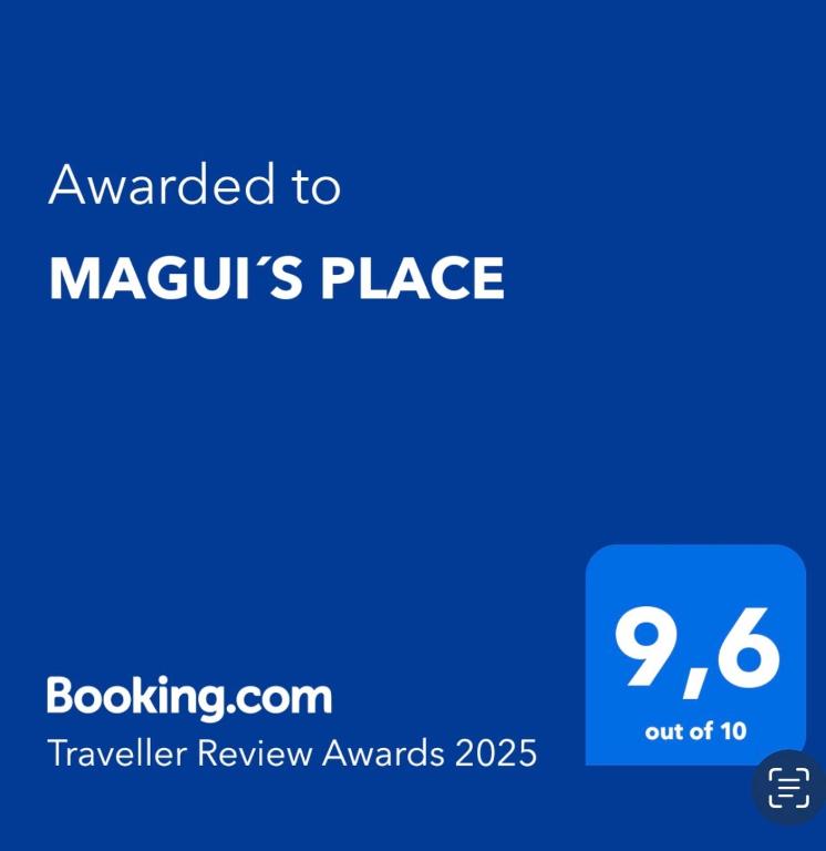a blue sign with the text awarded to mgurus place at MAGUI´S PLACE in Playa del Ingles