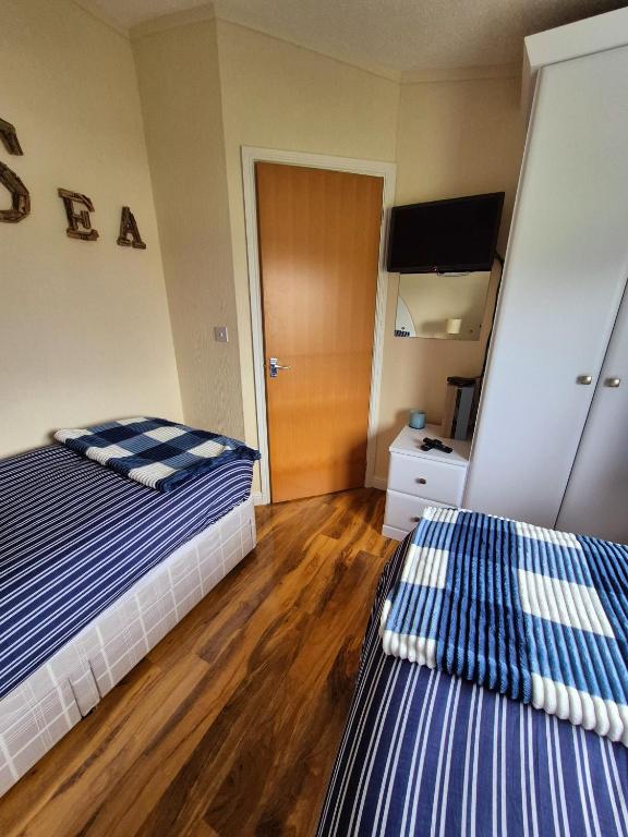 Postel nebo postele na pokoji v ubytování Top Lodge