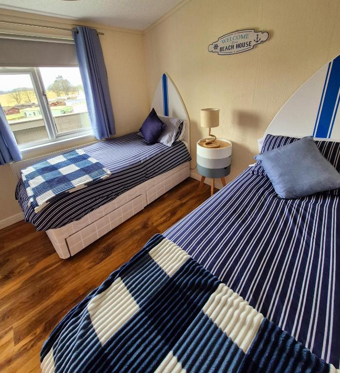 Postel nebo postele na pokoji v ubytování Top Lodge