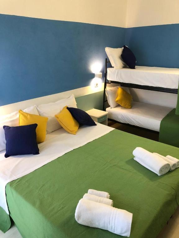 Postel nebo postele na pokoji v ubytování Hotel Napoleon