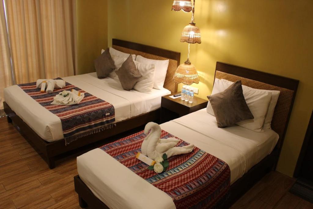 Postel nebo postele na pokoji v ubytování Alunsina Hotel and Spa