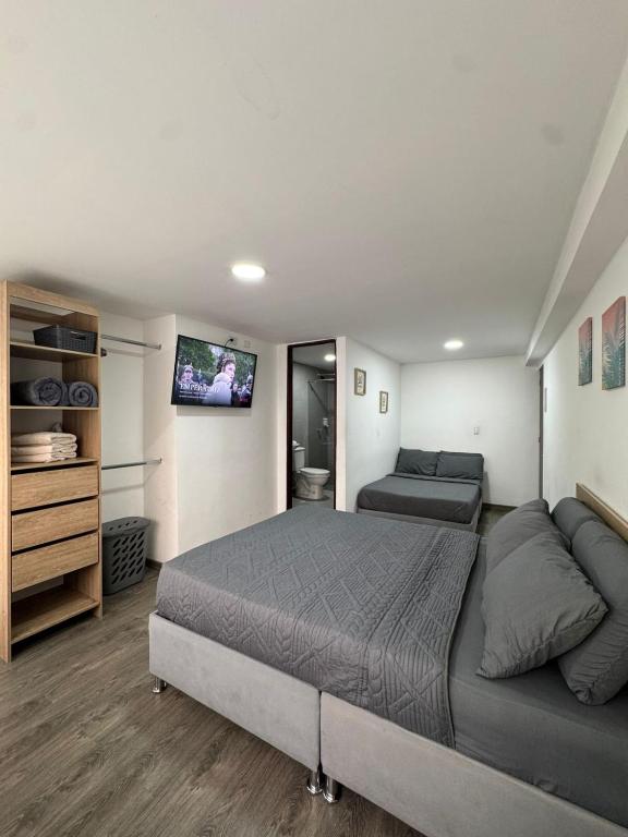Postel nebo postele na pokoji v ubytování Hostelfc San Luis