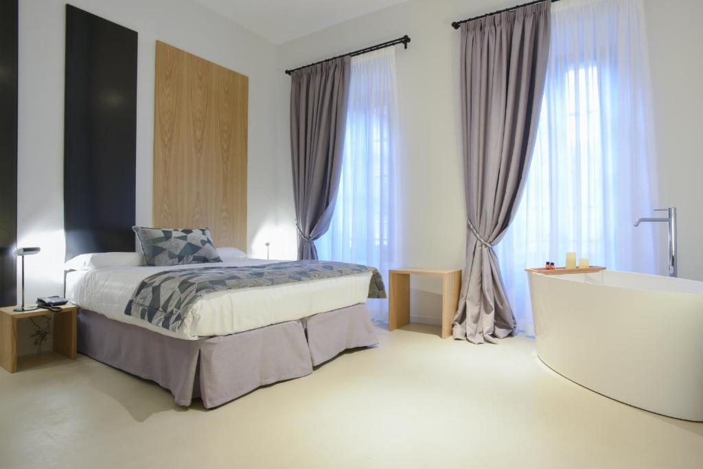 Giường trong phòng chung tại Viminale View Hotel