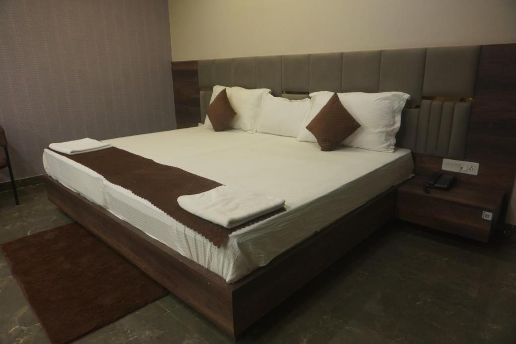 Postel nebo postele na pokoji v ubytování MOUNT VIEW HOTEL