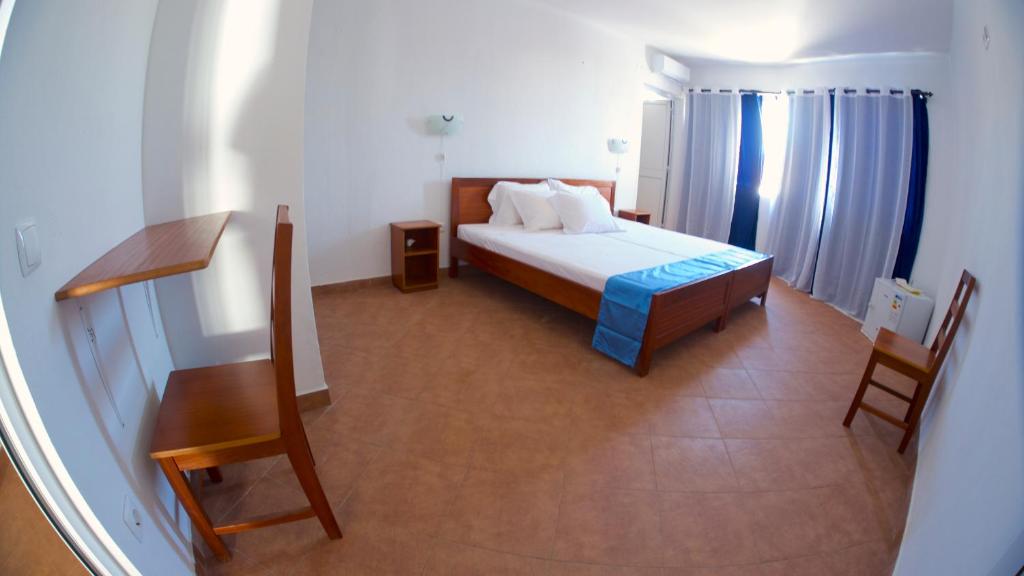 Postel nebo postele na pokoji v ubytování Cacimba Sunset Lodge